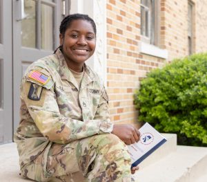 Photo of Tonneisha Bell, B.S. in Interdisciplinary Studies major dressed in military gear.
