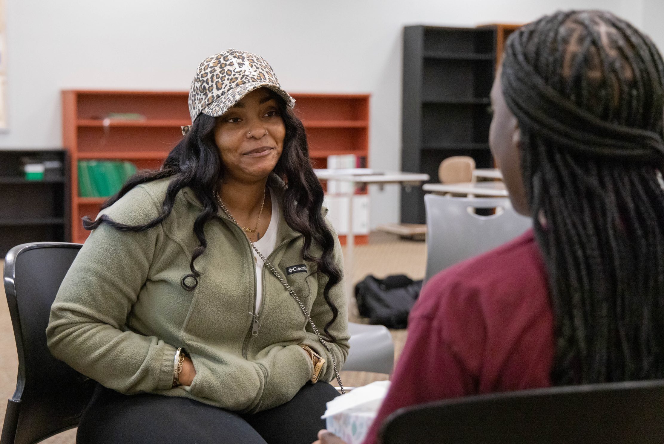 Student participating in a one-on-one discussion during class.