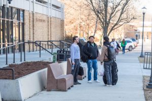 Students hanging out in front of the student union on the first day of class.