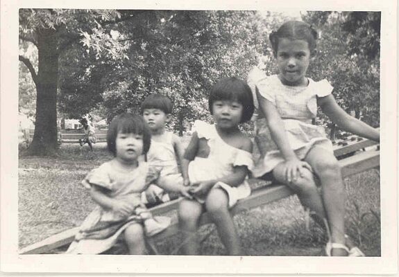 4 children on log, B&W.