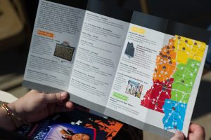 An attendee looks at a brochure illustrating the locations of the thirty-plus Freedom Trail markers.