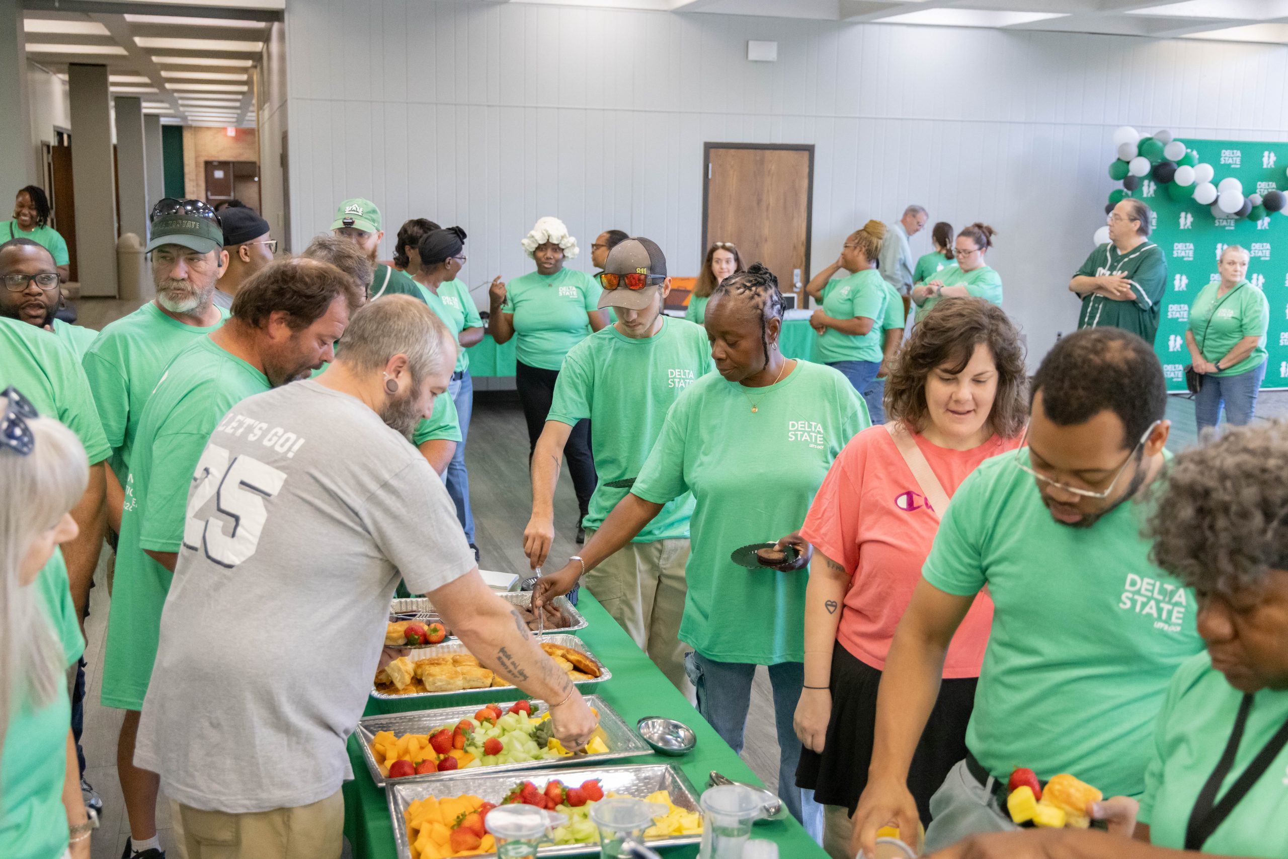 DSU staff in a buffet line.