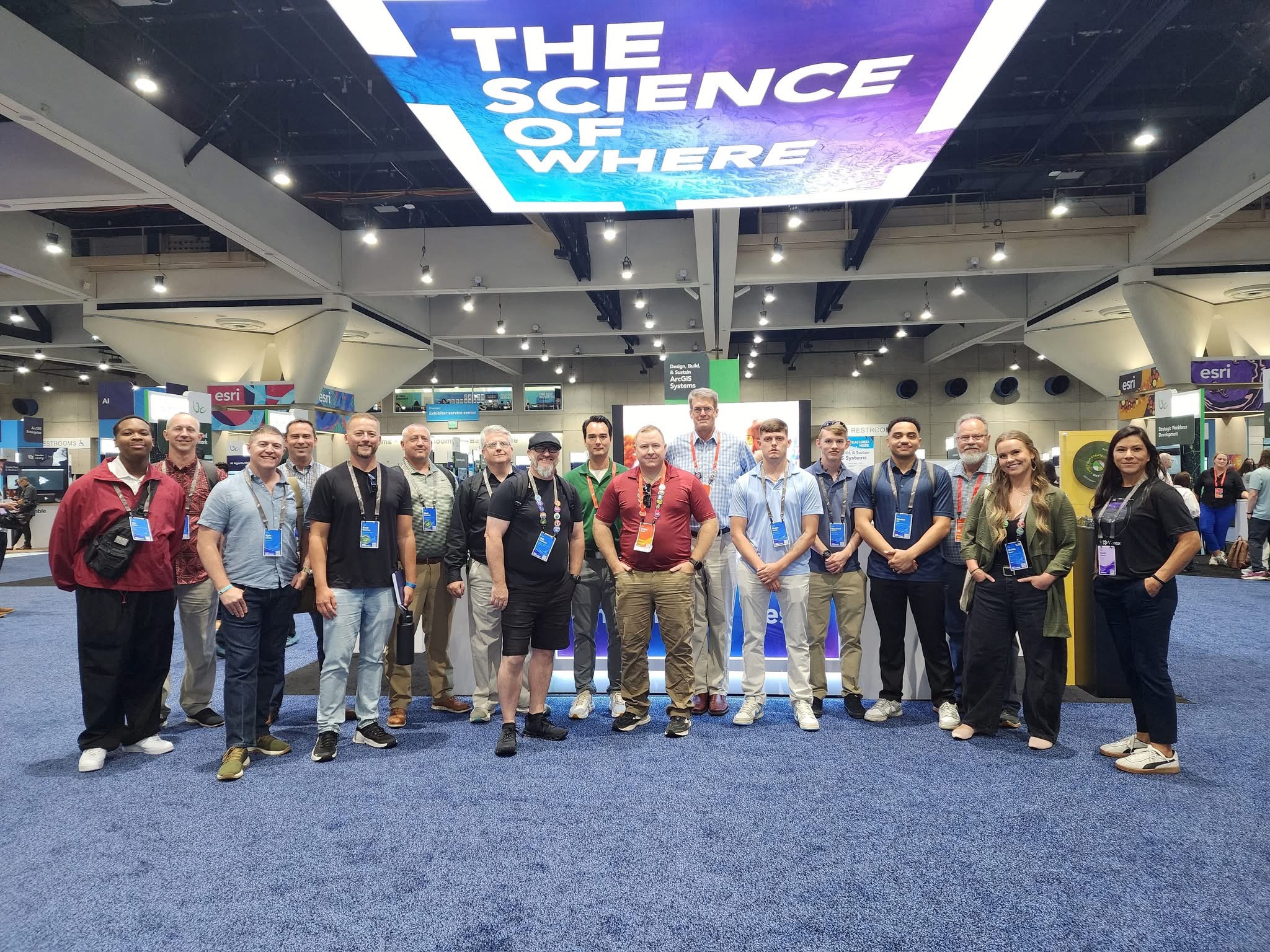 a group of people posing in a convention hall
