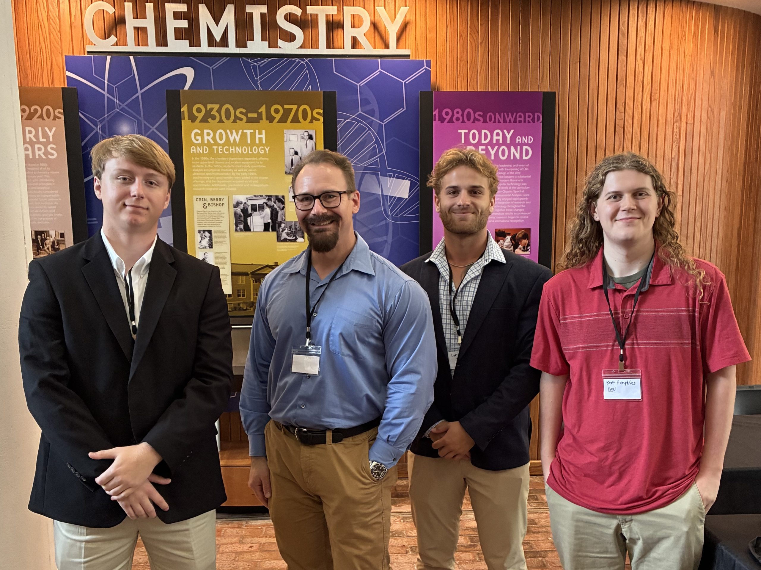 students and a faculty member at a science conference.