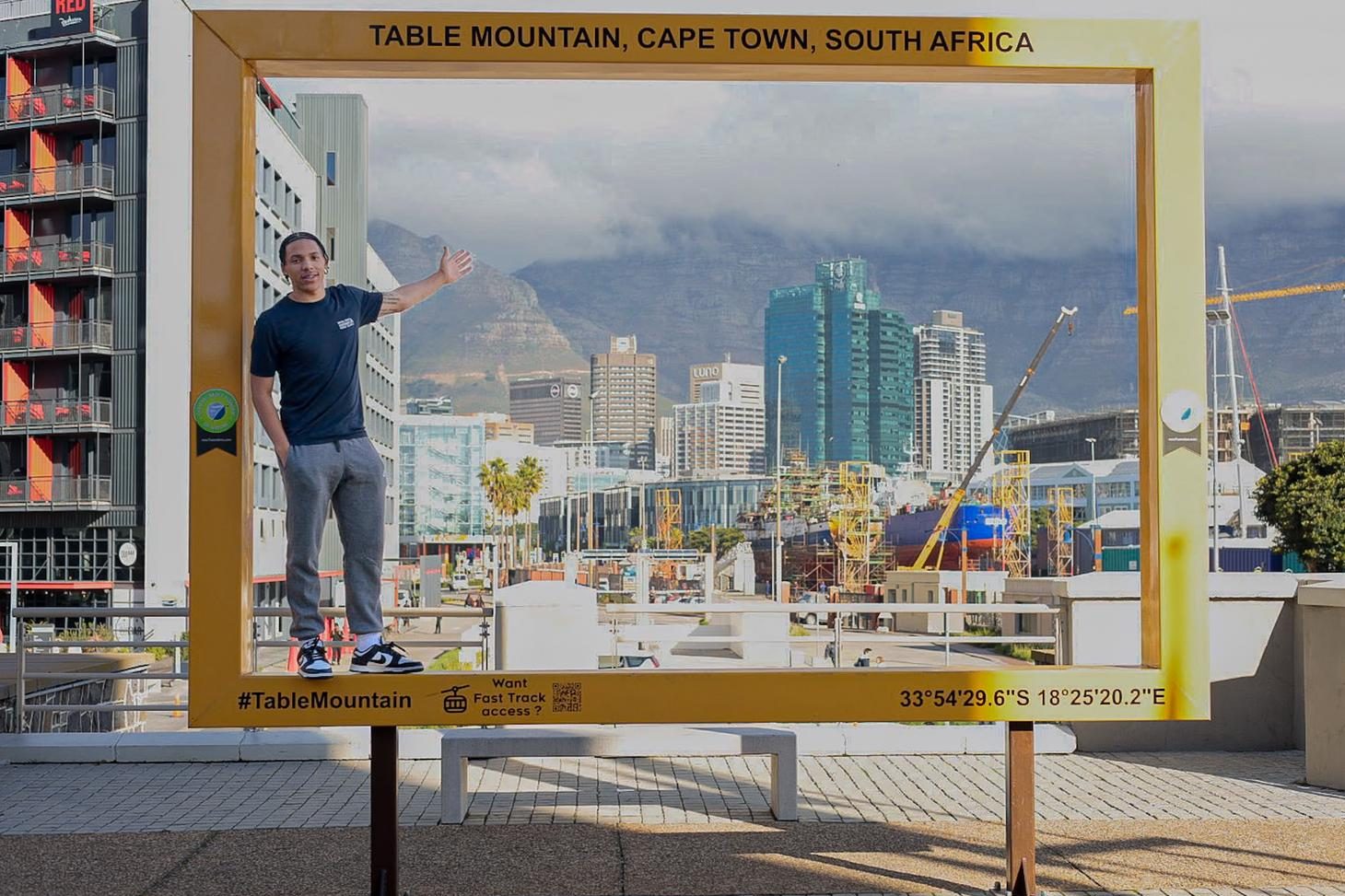 Photo of Jakori Johnson in front of Table Mountain in Cape Town, South Africa.